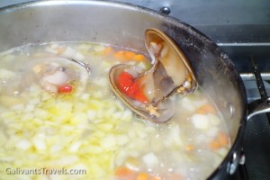 open clam in soup base for clam chowder