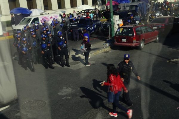 Group of Mexico City policemen with clear plastic shields